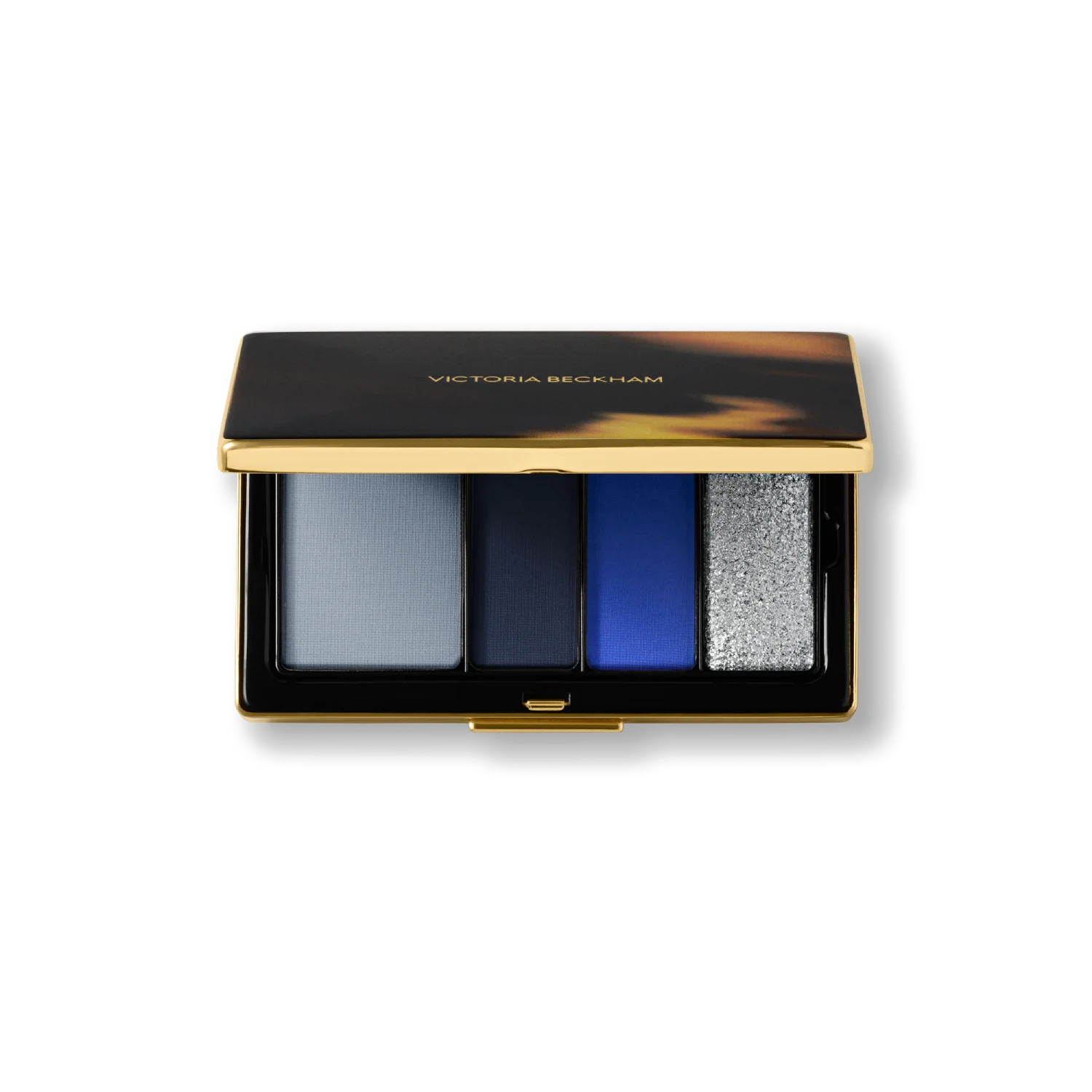 Victoria Beckham Beauty Eye Wardrobe in Navy Noir – luxury eyeshadow palette featuring four multi-finish shades in soft blue, deep navy, vibrant cobalt, and shimmering silver for a bold, modern eye look.