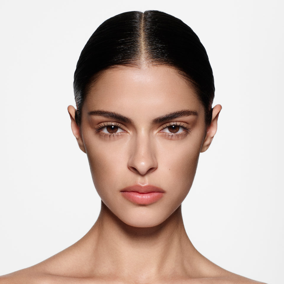 Close-up of a woman's face with a neutral background