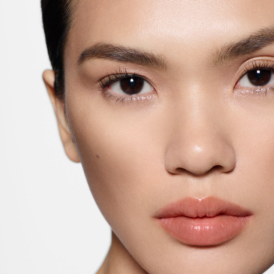 Close-up of a woman's face with a neutral background