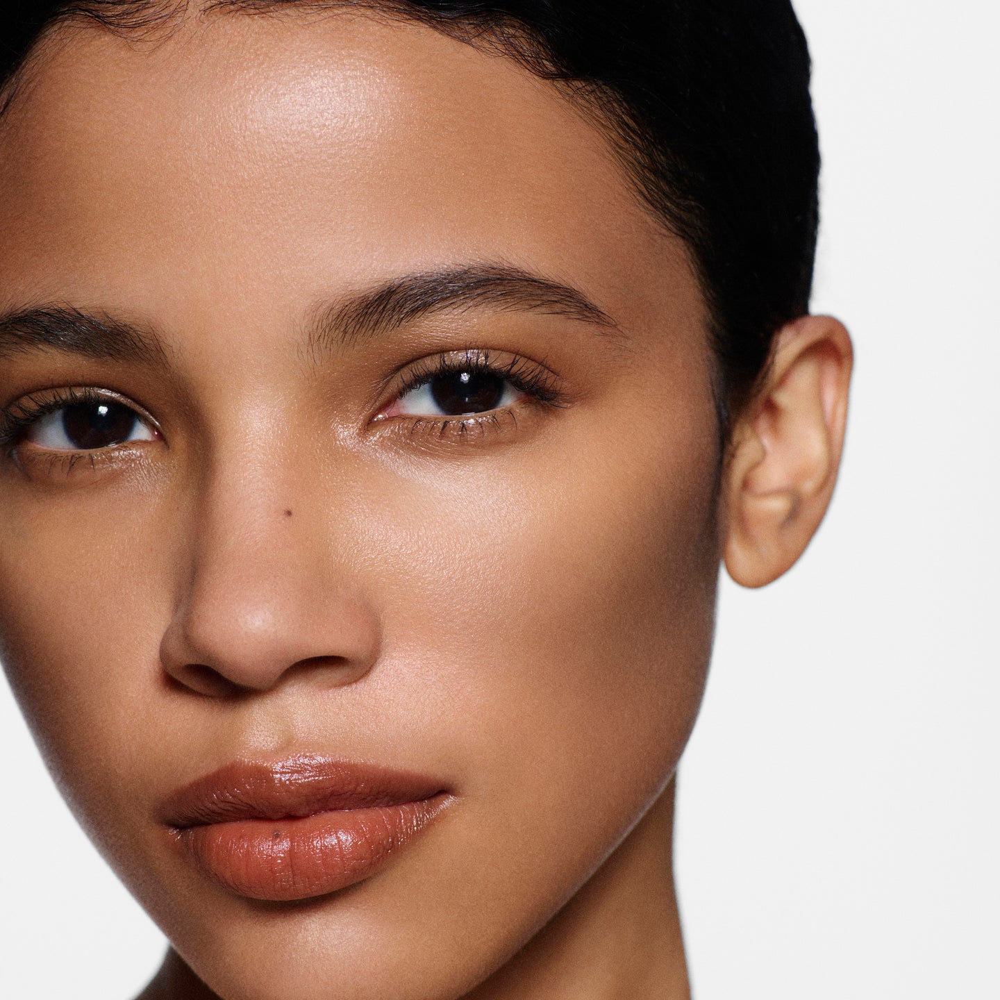Close-up of a woman's face with a neutral background
