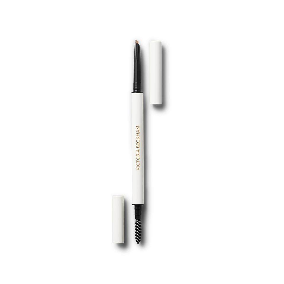 The BabyBlade Eyebrow Pencil in Light Blonde shown against a clean background. The dual-ended tool is pictured uncapped to reveal the ultra-fine precision tip on one end and the custom grooming spoolie brush on the other, designed for creating natural, hair-like strokes.