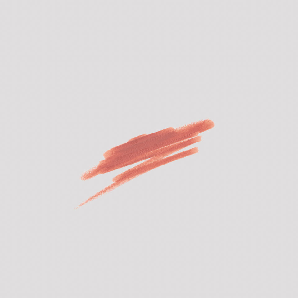 Swatch of Lip Definer No. 01 on grey backdrop — Victoria Beckham Beauty's dusty peach-rose lip pencil texture.