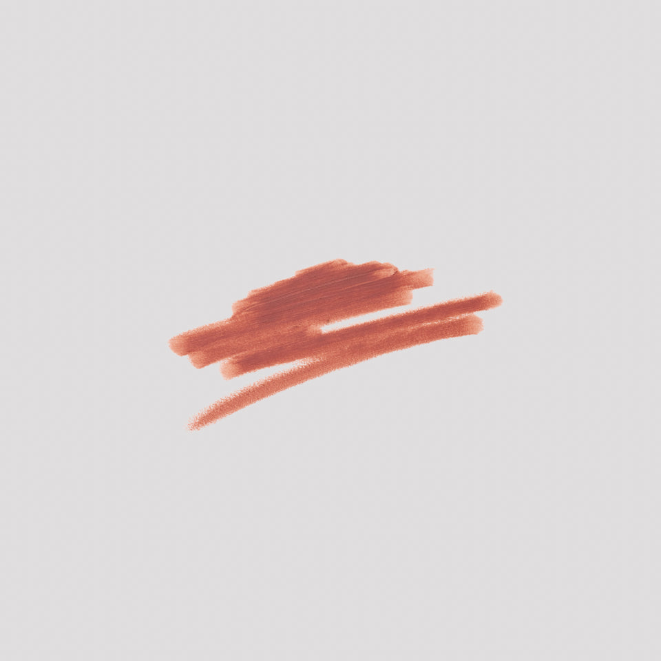 Swatch of Lip Definer No. 02 on grey backdrop — Victoria Beckham Beauty's warm rosewood lip pencil texture.