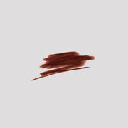 Swatch of Lip Definer No. 05 on grey backdrop — Victoria Beckham Beauty's cocoa brown lip pencil texture.