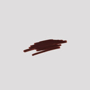 Swatch of Lip Definer No. 06 on grey backdrop — Victoria Beckham Beauty's deep espresso lip pencil texture.