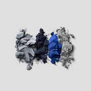 Victoria Beckham Beauty Eye Wardrobe in Navy Noir – texture shot showcasing rich eyeshadow pigments in soft blue, deep navy, vibrant cobalt, and shimmering silver for a bold, smoky eye look.