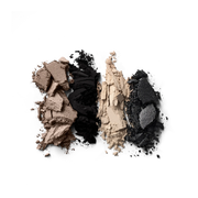 Victoria Beckham Beauty Eye Wardrobe in Night Flash – texture shot showcasing luxe eyeshadow pigments in shimmering taupe, deep matte black, soft ivory, and sparkling black for a bold, smoky finish.