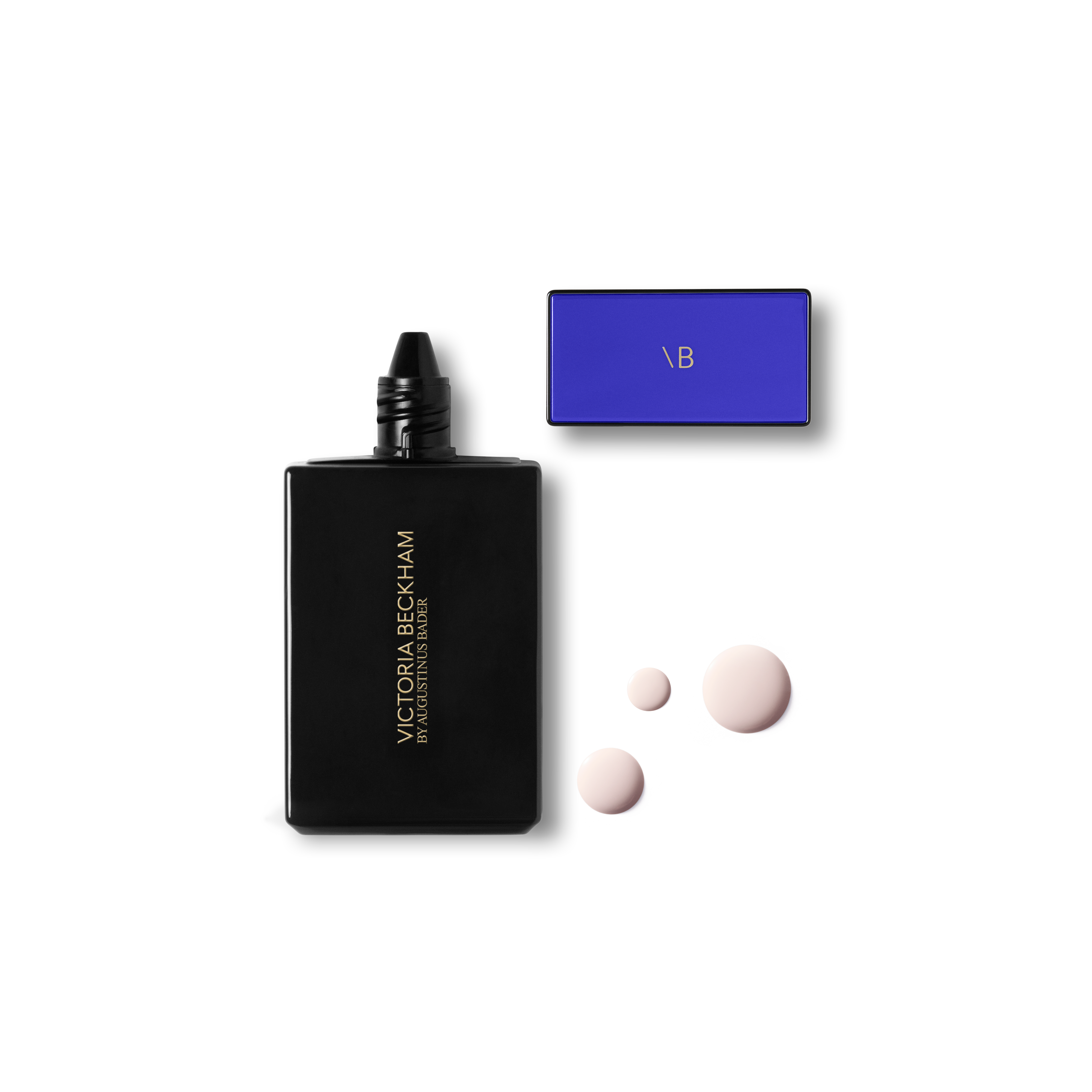 Black Victoria Beckham foundation with a blue cap and three light skin-like color swatches on a white background