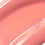 Posh Gloss Picante swatch — Victoria Beckham Beauty's vivid coral salmon high-shine lip gloss, cropped close-up. swatch