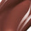 Posh Gloss Poolside swatch — Victoria Beckham Beauty's cocoa brown high-shine lip gloss, cropped close-up. swatch