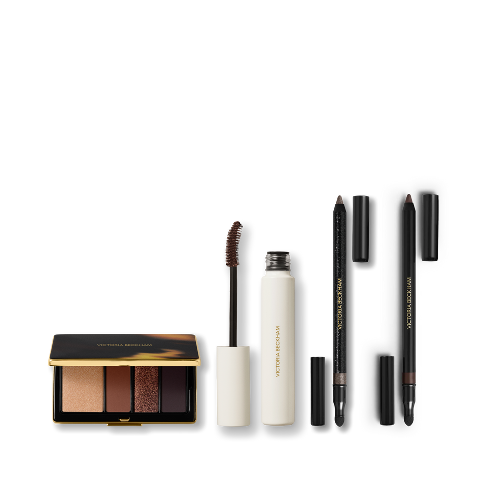 Eye Wardrobe in Cocoa, cocoa-tinted mascara and two Satin Kajal Liners on grey — Victoria Beckham Beauty Cocoa Eye Edit.