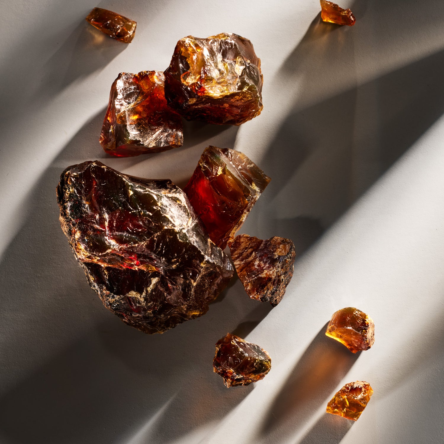 Raw amber stones on a light background