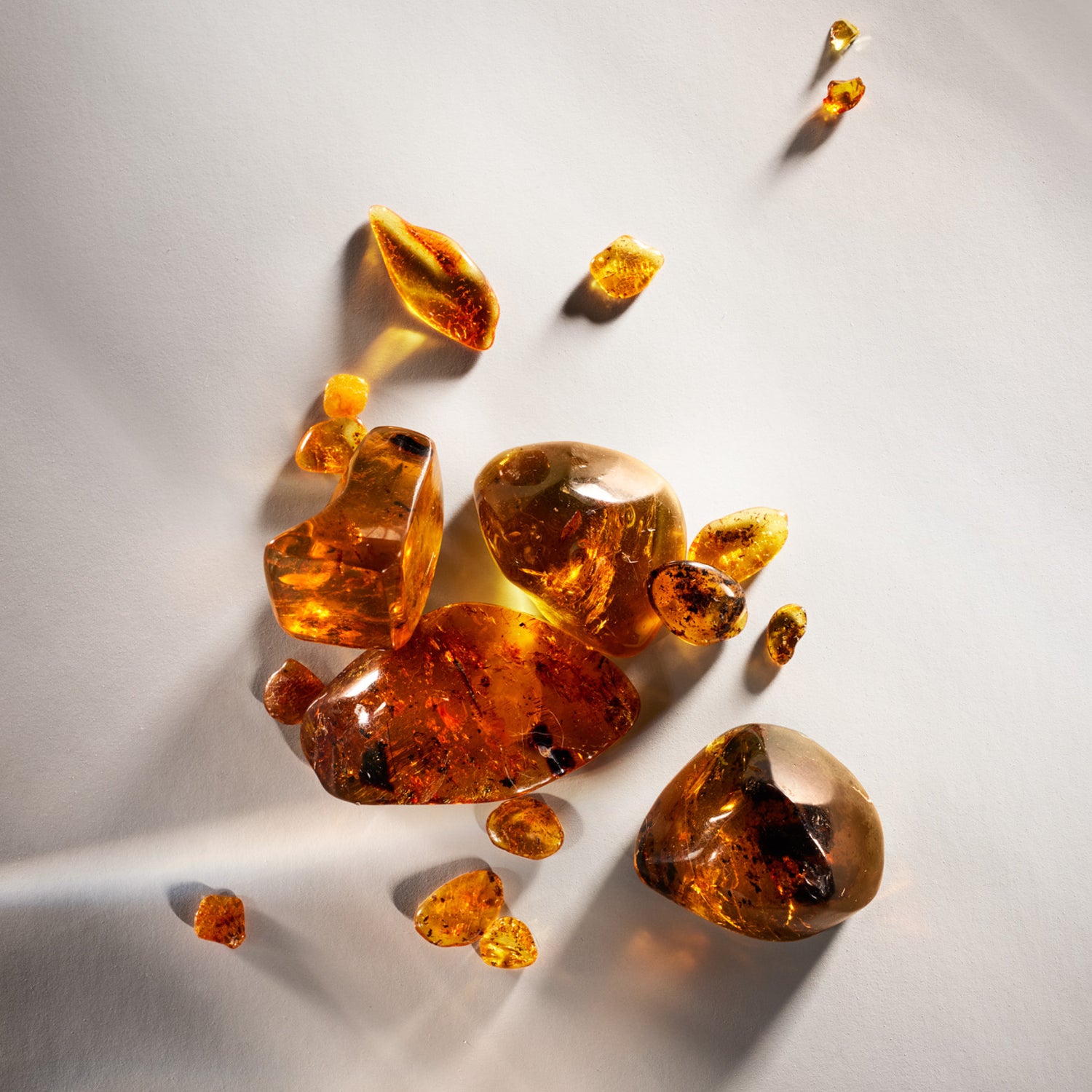  amber stones on a white background