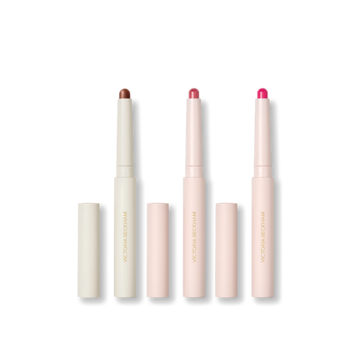 Three stylus pencils on black — Contour Stylus, Blush Stylus in Rossa and Blush Stylus in Fiore — Victoria Beckham Beauty.