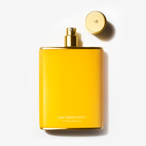 Flat-lay image of the San Ysidro Drive Fragrance bottle, with the lid off.