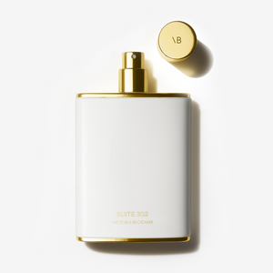 Flat-lay image of the Suite 302 Fragrance bottle, with the lid off.