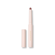 Open Victoria Beckham Beauty Blush Stylus in Sienna — pale-pink stylus pencil with warm reddish-brown bullet exposed.