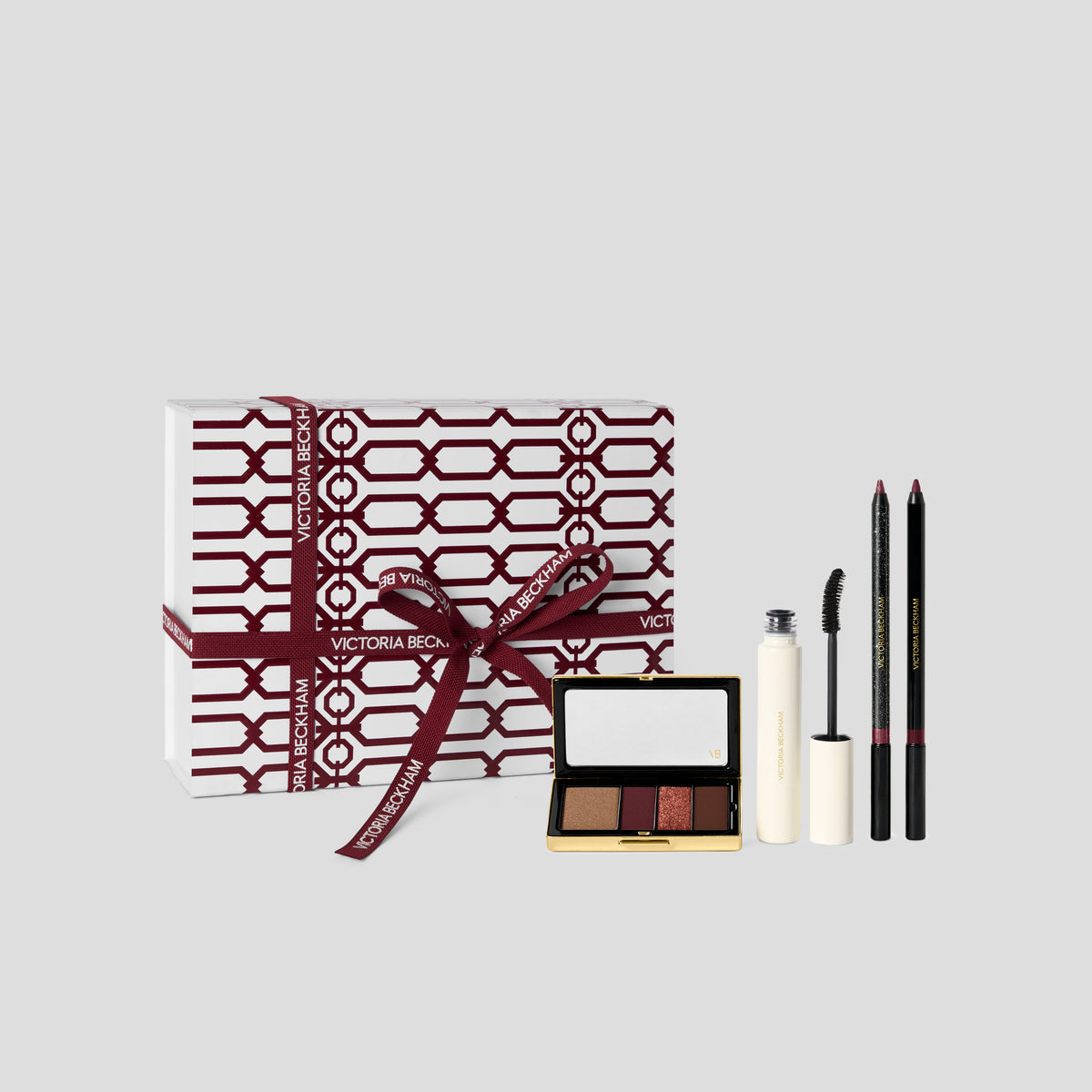 Bordeaux Eye Kit gift box in burgundy trellis print with a bronze-burgundy eyeshadow quad, mascara and pencils — Victoria Beckham Beauty.