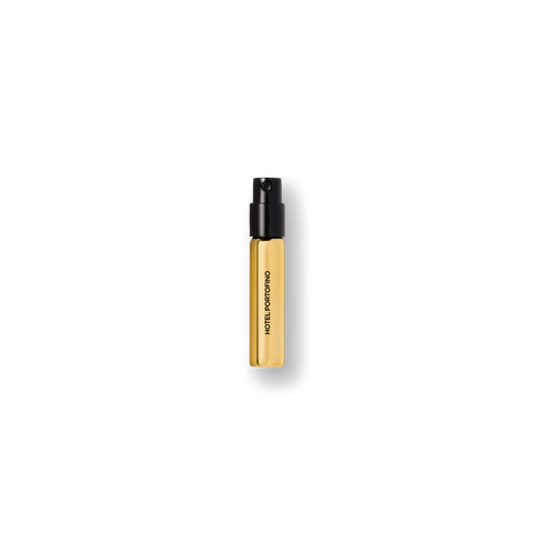 Gold 2 mL Hotel Portofino sample vial with a black spray cap — travel size fragrance by Victoria Beckham Beauty.
