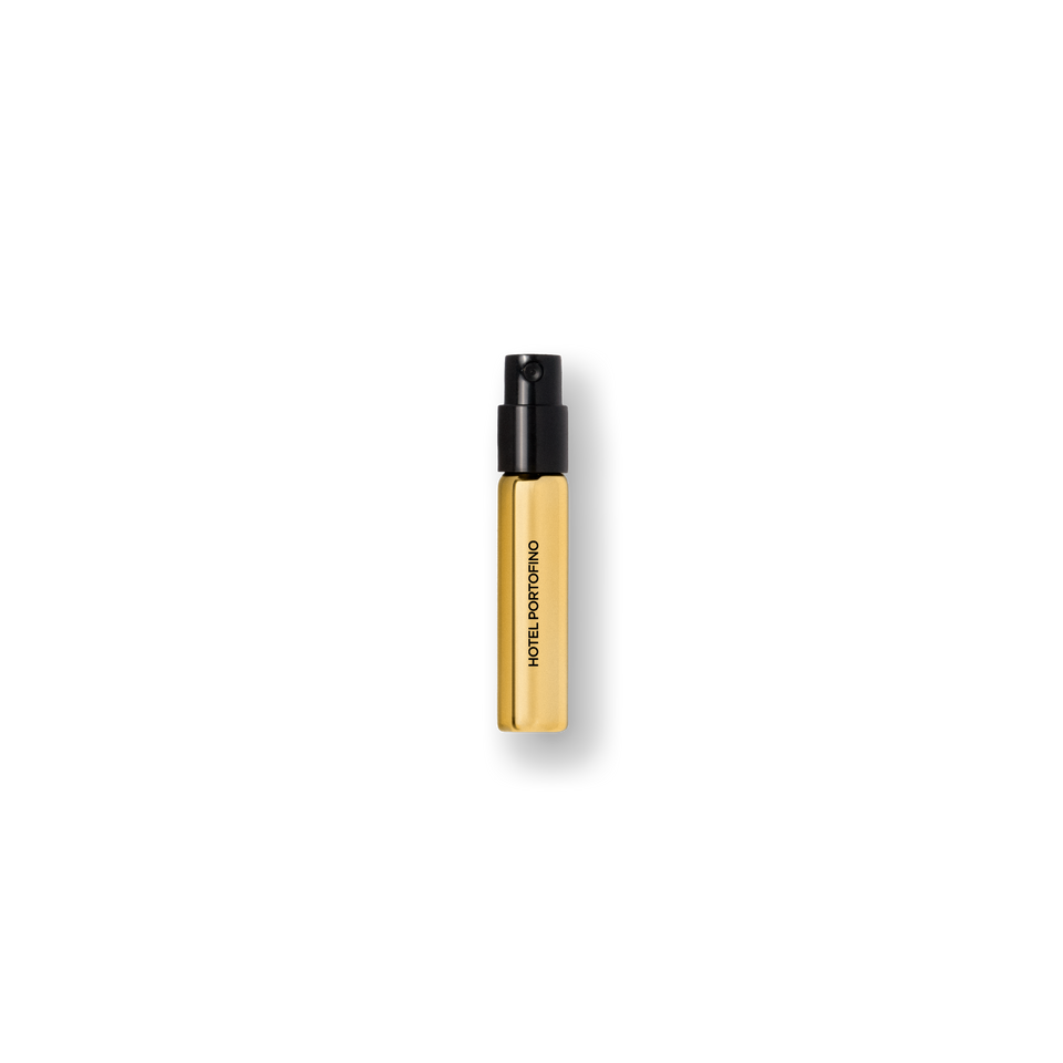 Gold 2 mL Hotel Portofino sample vial with a black spray cap — travel size fragrance by Victoria Beckham Beauty.