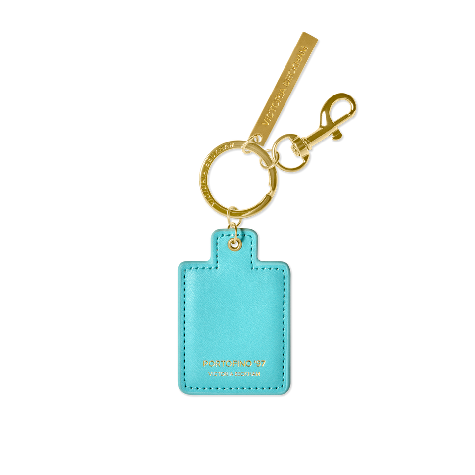 Turquoise keychain with gold clasp on a white background