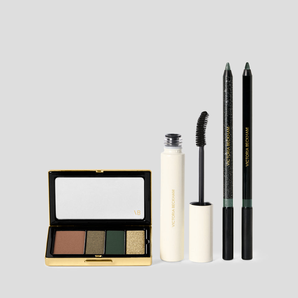 Olive Eye Kit laid out: copper, khaki, green and gold eyeshadow quad, mascara and two pencils — Victoria Beckham Beauty.