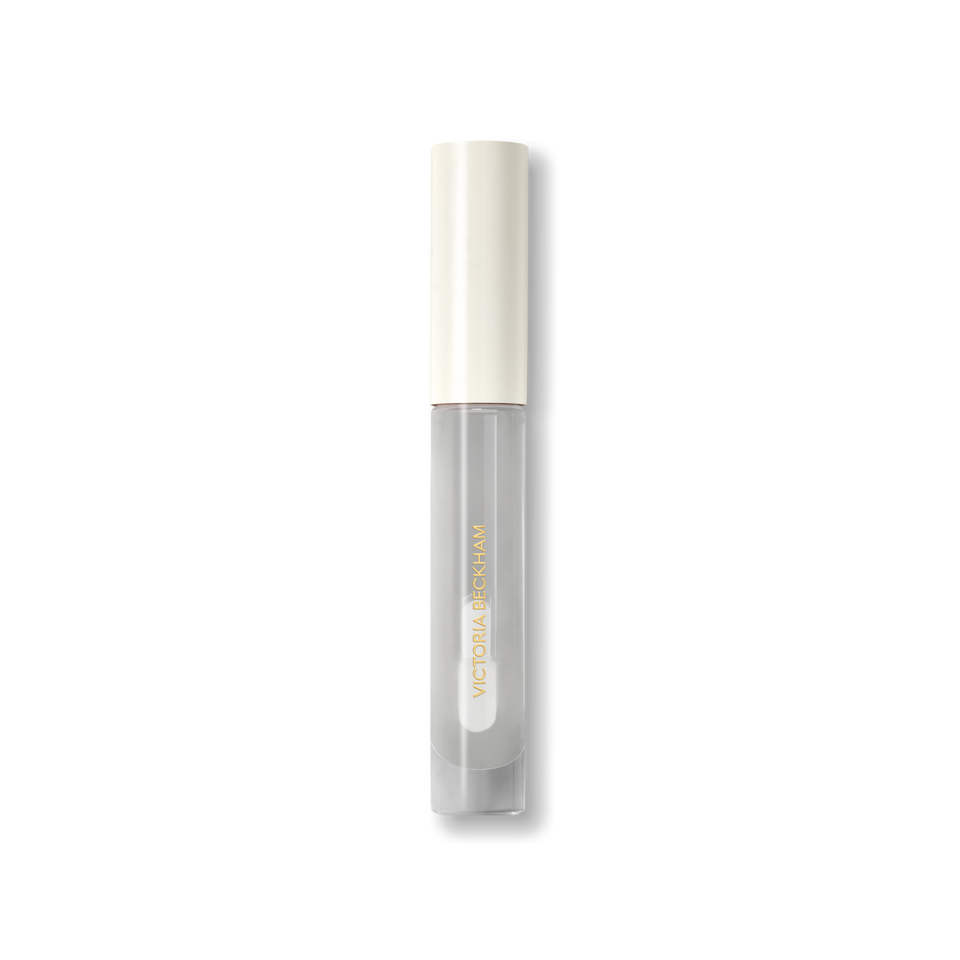 Closed Victoria Beckham Beauty Posh Gloss tube in Ice — cream cap on a clear, glassy high-shine lip gloss.