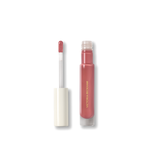 Open Victoria Beckham Beauty Posh Gloss in Cabana — cream cap and doe-foot wand reveal the dusty rose pink gloss.
