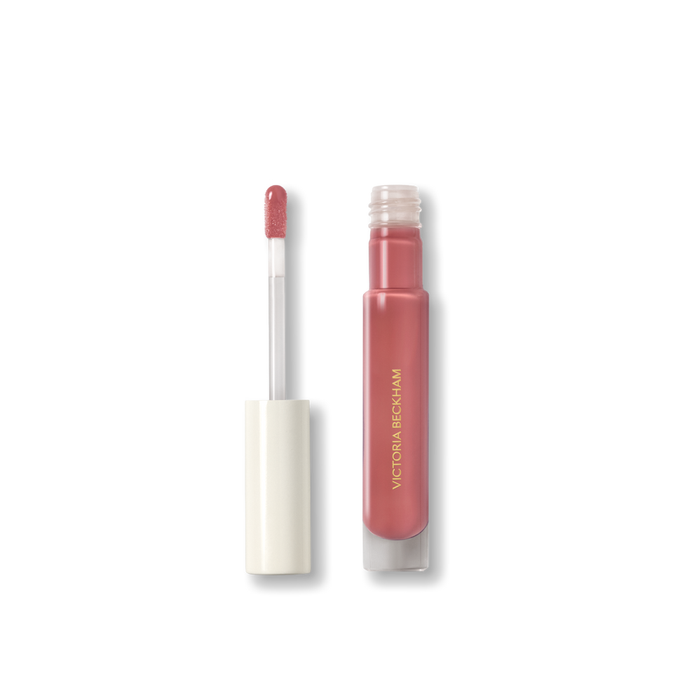 Open Victoria Beckham Beauty Posh Gloss in Cabana — cream cap and doe-foot wand reveal the dusty rose pink gloss.