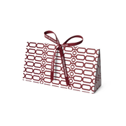 Burgundy trellis-print gift box tied with a branded ribbon bow on grey — Victoria Beckham Beauty holiday gift packaging.