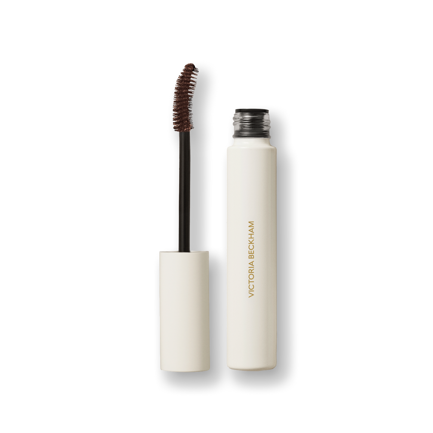 Open Victoria Beckham Beauty Vast Lash mascara in Cocoa — cream tube with wand and cocoa-brown bristles visible.