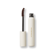 Open Victoria Beckham Beauty Vast Lash mascara in Cocoa — cream tube with wand and cocoa-brown bristles visible.