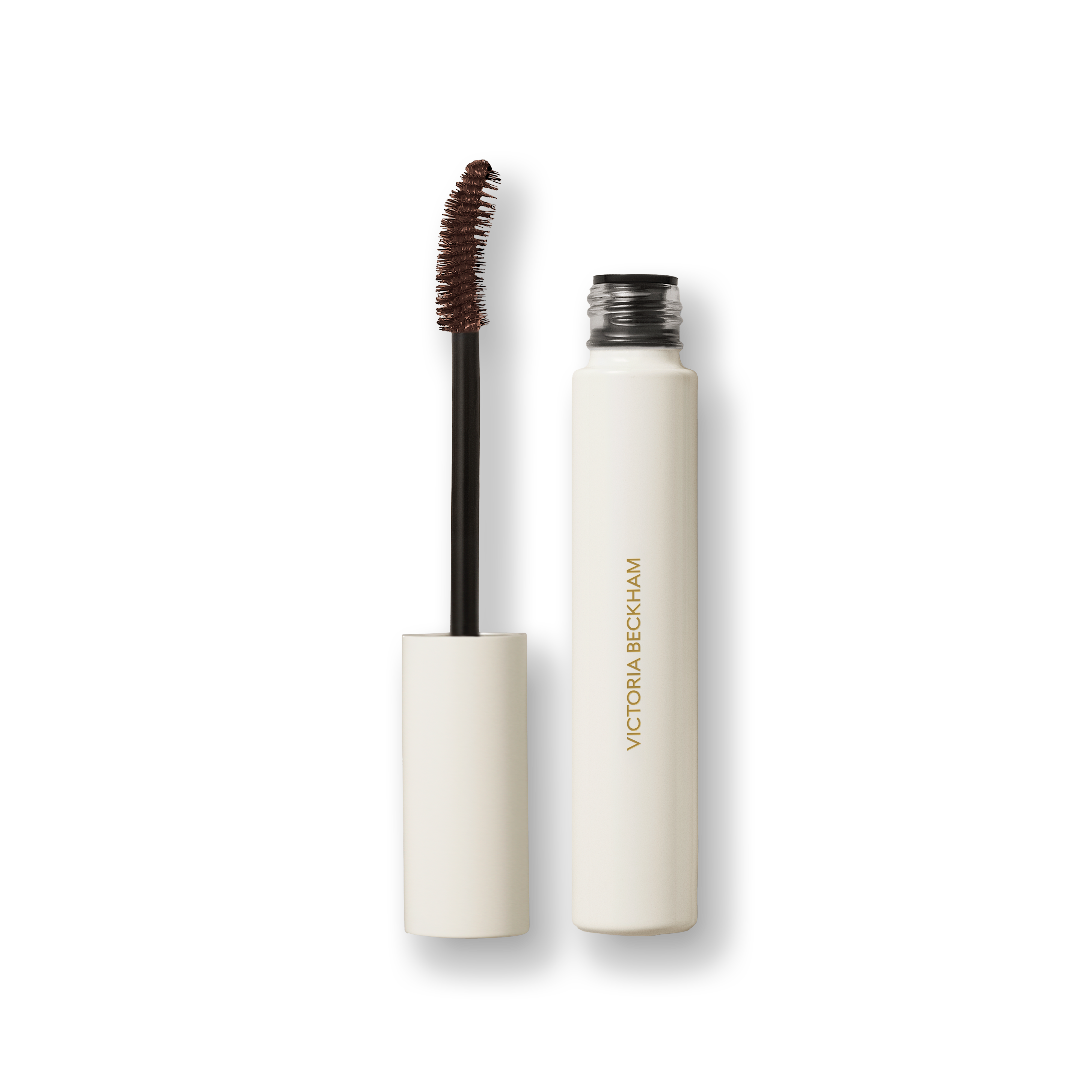 Open Victoria Beckham Beauty Vast Lash mascara in Cocoa — cream tube with wand and cocoa-brown bristles visible.