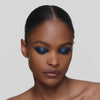 Product video of the Victoria Beckham Satin Kajal Liner in Navy Noir Pavé, showing the pencil's glitter texture and application."