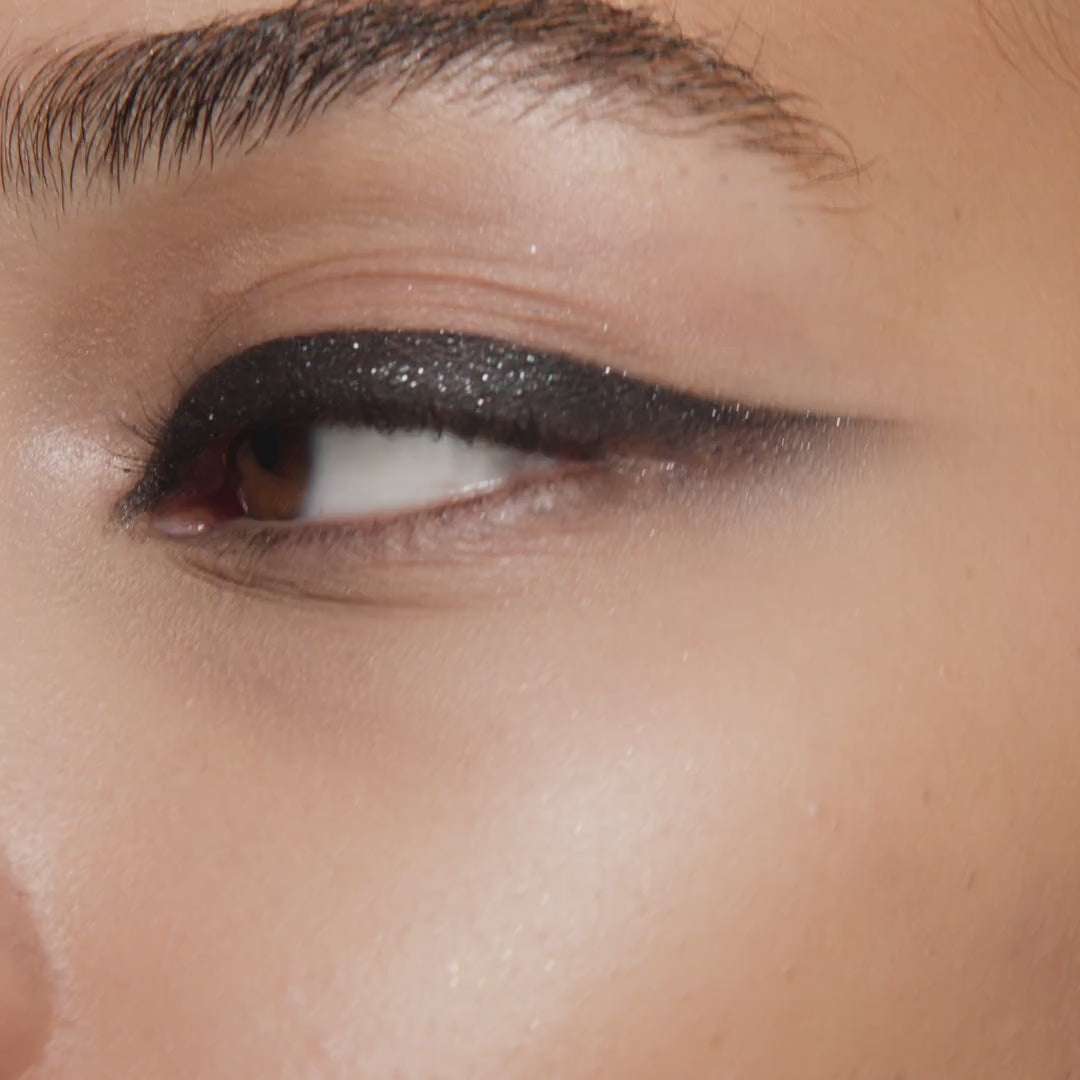 Model wearing Victoria Beckham Beauty Eye Wardrobe in Night Flash – video showcasing the bold, smoky eyeshadow look with shimmering taupe, deep black, and soft ivory tones in motion.