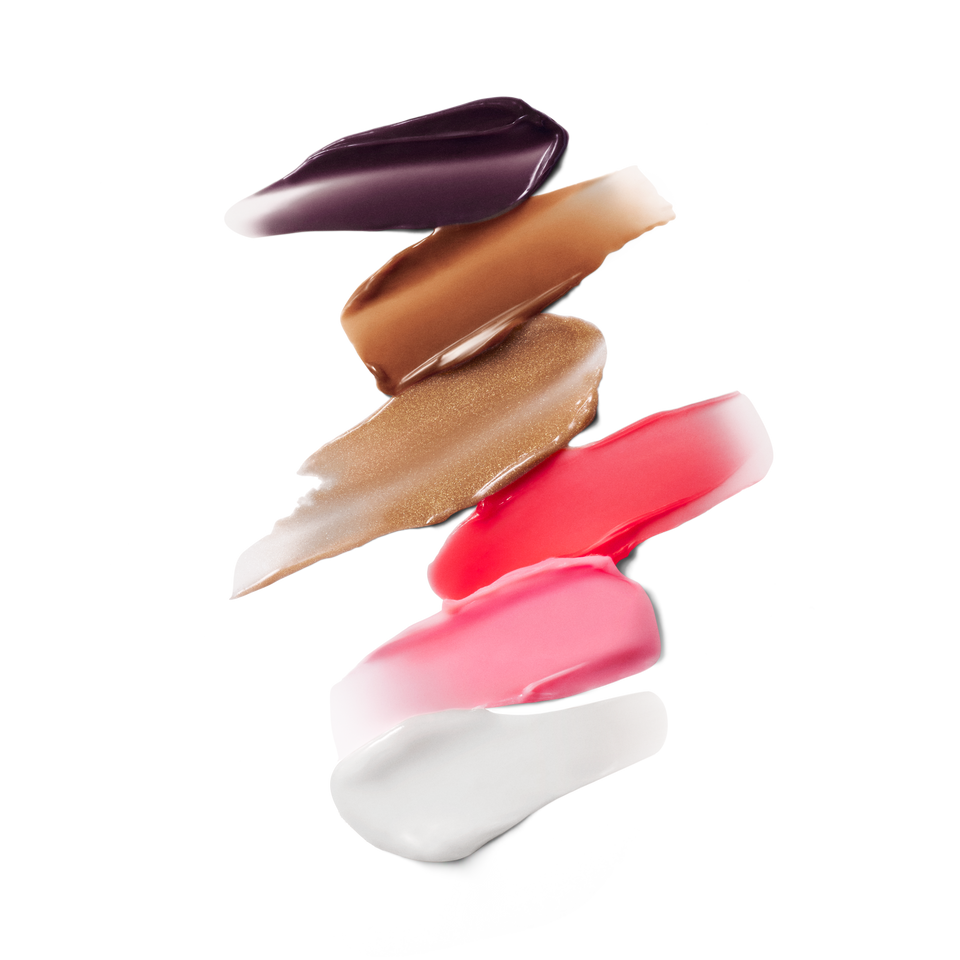 Six Posh Balm swatches — plum, caramel, golden bronze shimmer, coral, pink and clear by Victoria Beckham Beauty.