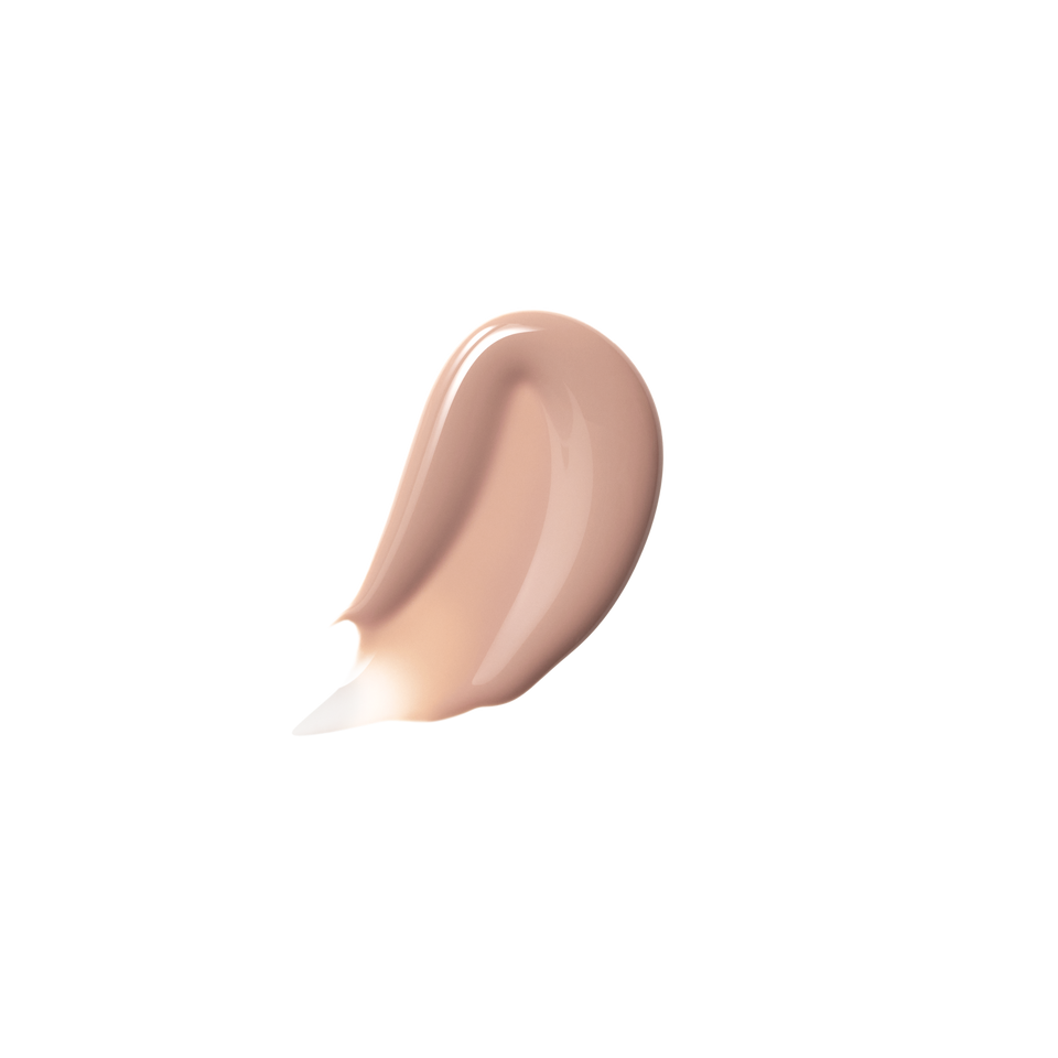 Glossy swatch of Posh Gloss Bikini — Victoria Beckham Beauty's milky peach nude lip gloss with high-shine mirror finish.
