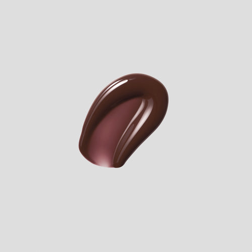 Glossy swatch of Posh Gloss TopDown on grey backdrop — Victoria Beckham Beauty's deep mahogany high-shine lip gloss.