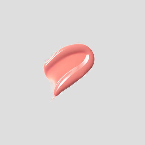 Glossy swatch of Posh Gloss Picante on grey backdrop — Victoria Beckham Beauty's vivid coral salmon high-shine lip gloss.