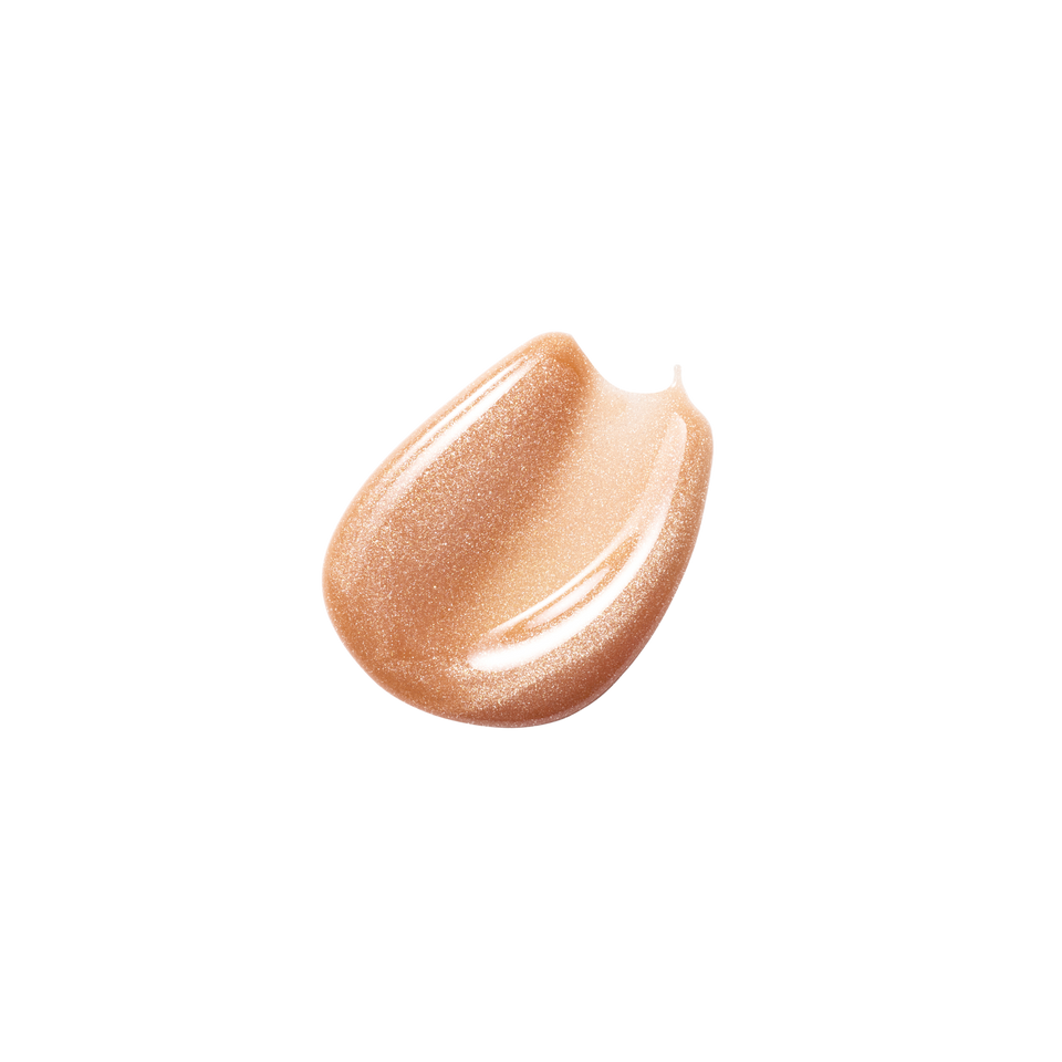 Glossy swatch of Posh Gloss Martini — Victoria Beckham Beauty's champagne gold shimmer lip gloss with mirror-finish shine.