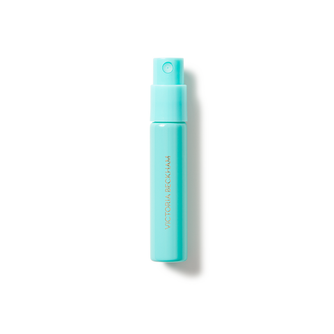 Turquoise spray bottle with gold text and pump atomizer top.