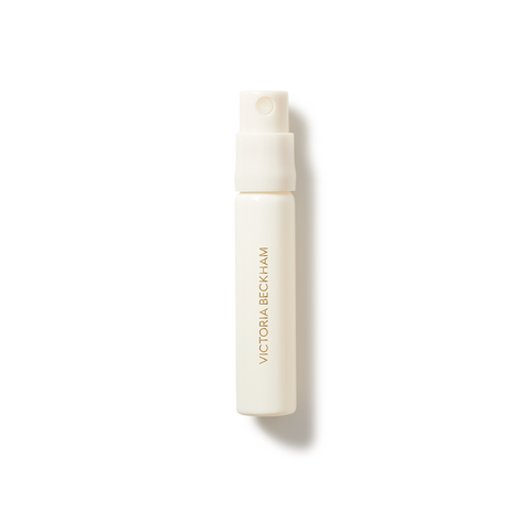 Small cream-colored spray bottle labeled "Victoria Beckham" for eau de parfum.